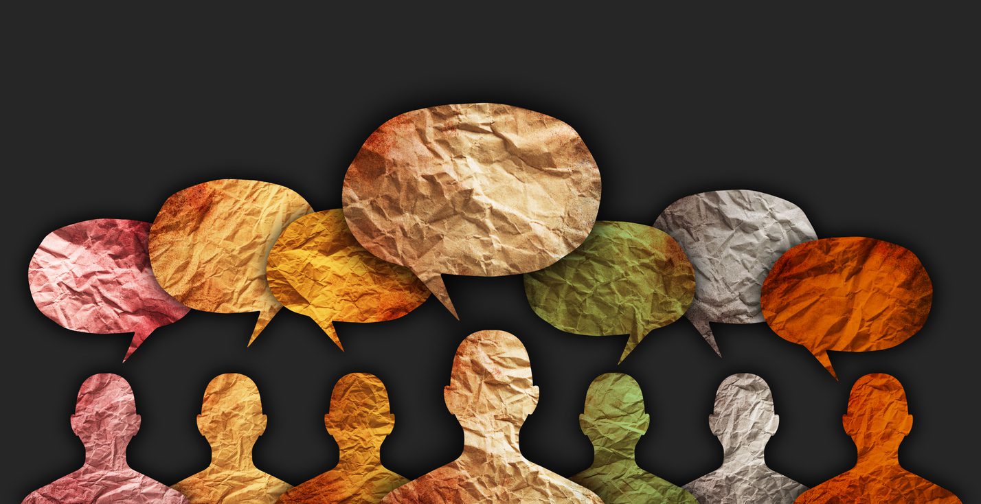 Diverse individuals communicating through speech bubbles, symbolizing the collaboration and innovation of a data-driven culture in your organization.